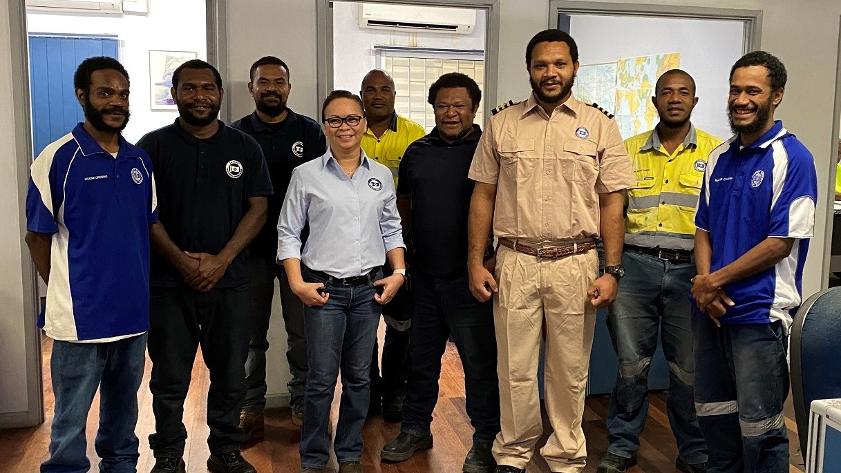 Photo: Chief Mate Craig Selan (third from right), Crewing Manager Nannette Camba (third from left) and the Lae crewing team share a group photo.